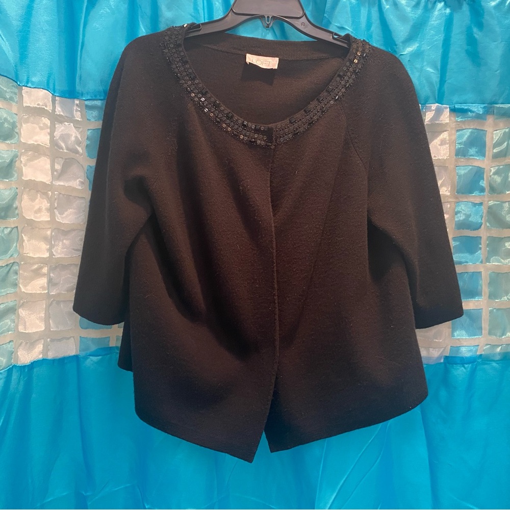 Sweater shrug with added detail
